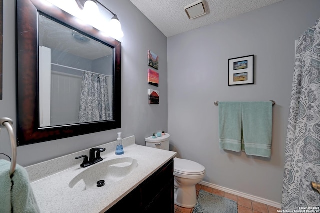 3734 Colter, San Antonio, TX 78247 - full bath with toilet, vanity, tile patterned flooring, a textured ceiling, and curtained shower