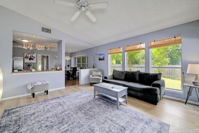 3734 Colter, San Antonio, TX 78247 - living area with a textured ceiling, wood finished floors, vaulted ceiling, ceiling fan, and baseboards