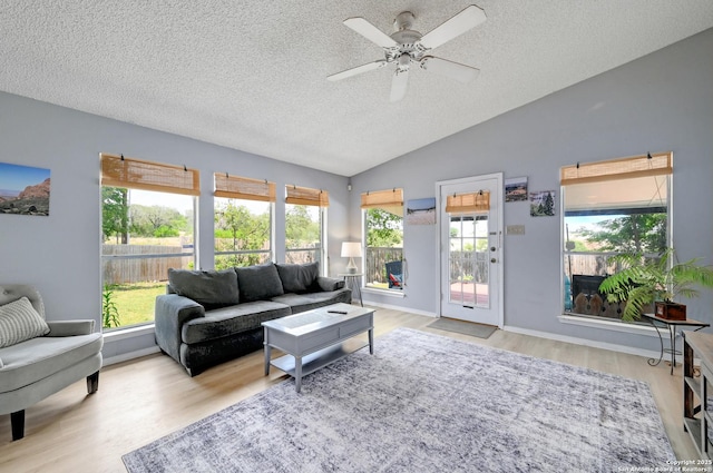 3734 Colter, San Antonio, TX 78247 - living area with a textured ceiling, wood finished floors, a ceiling fan, lofted ceiling, and healthy amount of natural light