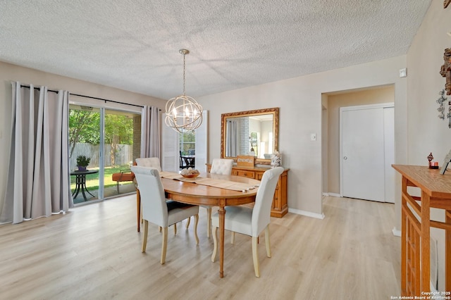 3734 Colter, San Antonio, TX 78247 - dining room with light wood-type flooring, a chandelier, and a textured ceiling
