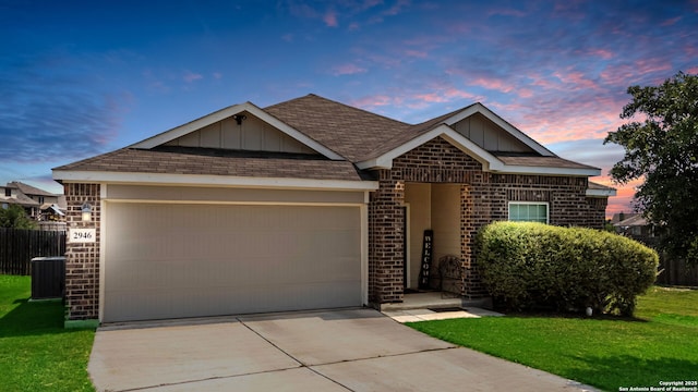 2946 Daisy Mdw, New Braunfels, TX 78130 - ranch-style house with brick siding, an attached garage, board and batten siding, driveway, and a shingled roof