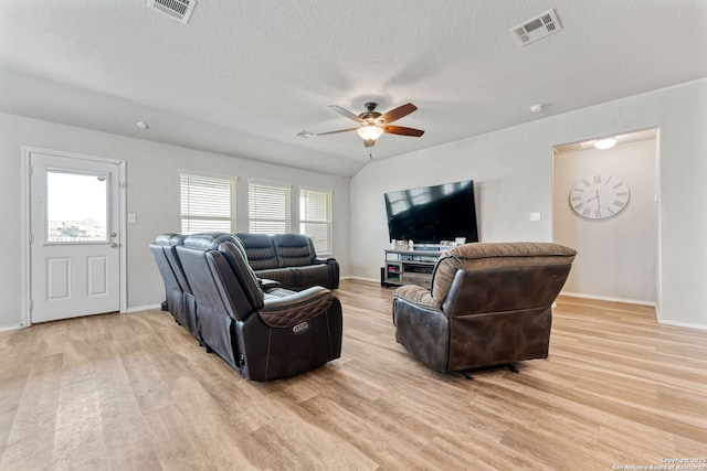 2946 Daisy Mdw, New Braunfels, TX 78130 - living area with ceiling fan, plenty of natural light, light wood finished floors, and a textured ceiling