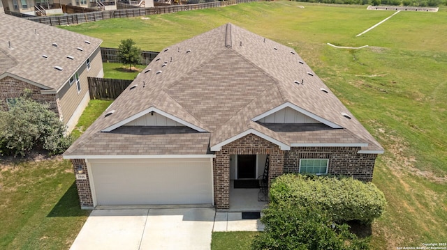 2946 Daisy Mdw, New Braunfels, TX 78130 - view of front of home with brick siding, an attached garage, concrete driveway, and board and batten siding