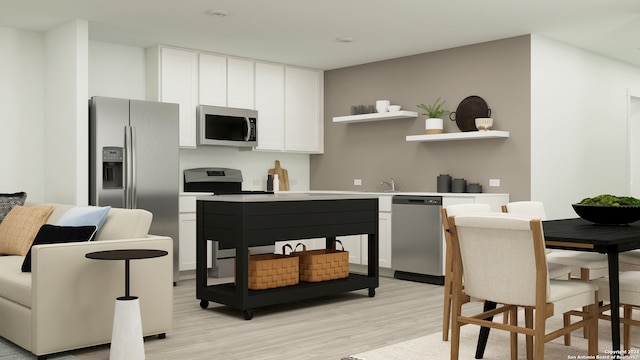 2830 Carnelian Trl, San Antonio, TX 78264 - kitchen featuring appliances with stainless steel finishes, light wood finished floors, open shelves, white cabinets, and light countertops