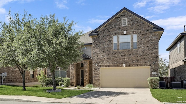 27013 Camellia Trce, Boerne, TX 78015 - traditional-style home featuring brick siding, driveway, an attached garage, and a front lawn