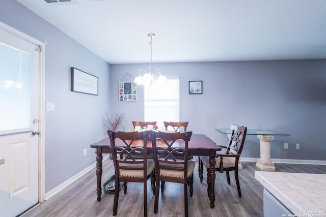 5634 Forest Cyn, San Antonio, TX 78252 - dining room featuring dark wood-style flooring, a chandelier, and baseboards