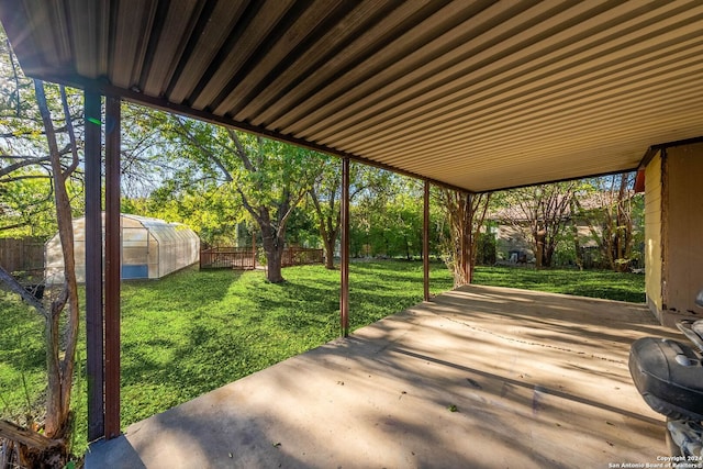 11415 Rousseau St, San Antonio, TX 78251 - view of patio with a greenhouse and an outbuilding
