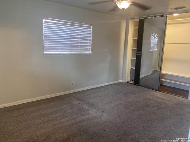 5142 Village Ct, San Antonio, TX 78218 - unfurnished bedroom featuring baseboards, carpet flooring, a ceiling fan, and a closet