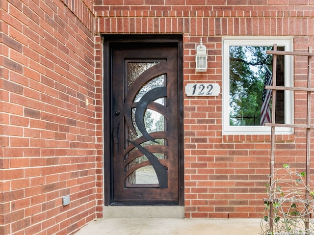 122 Kettle Cv, Universal City, TX 78148 - view of exterior entry featuring brick siding