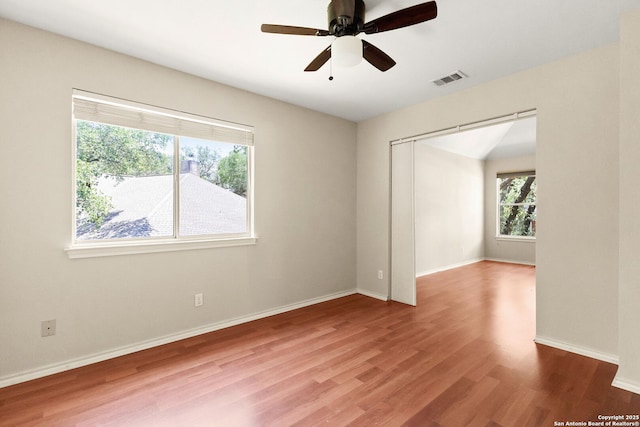 122 Kettle Cv, Universal City, TX 78148 - empty room with wood finished floors, a ceiling fan, and baseboards