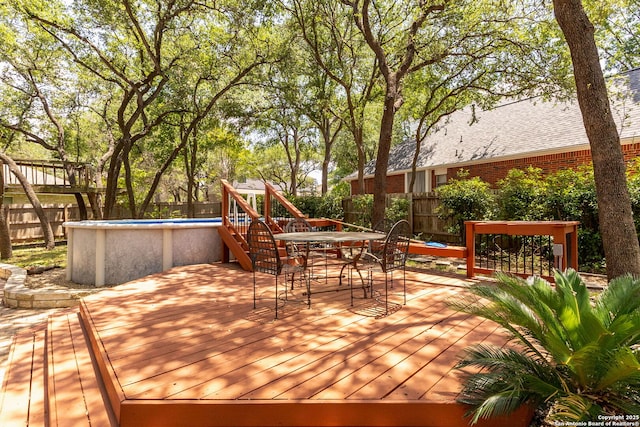 122 Kettle Cv, Universal City, TX 78148 - wooden terrace with a fenced backyard and outdoor dining area