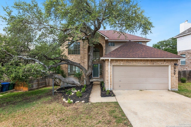959 Lightstone Dr, San Antonio, TX 78258 - traditional home with driveway, an attached garage, roof with shingles, and brick siding
