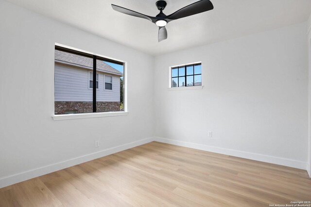 959 Lightstone Dr, San Antonio, TX 78258 - spare room with baseboards, ceiling fan, and light wood-style floors