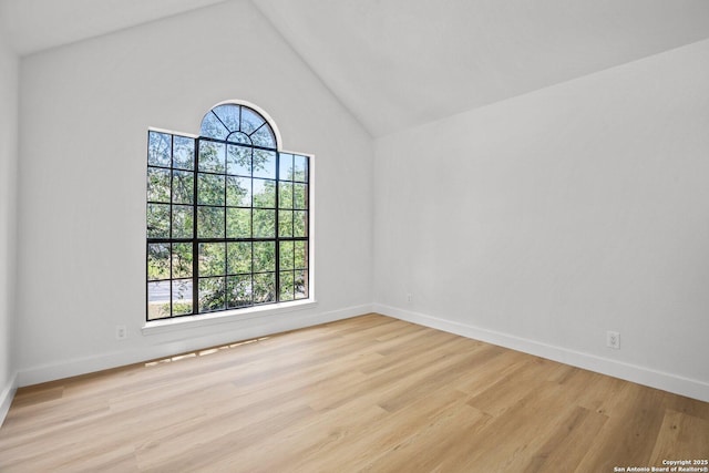 959 Lightstone Dr, San Antonio, TX 78258 - spare room featuring wood finished floors, baseboards, and high vaulted ceiling