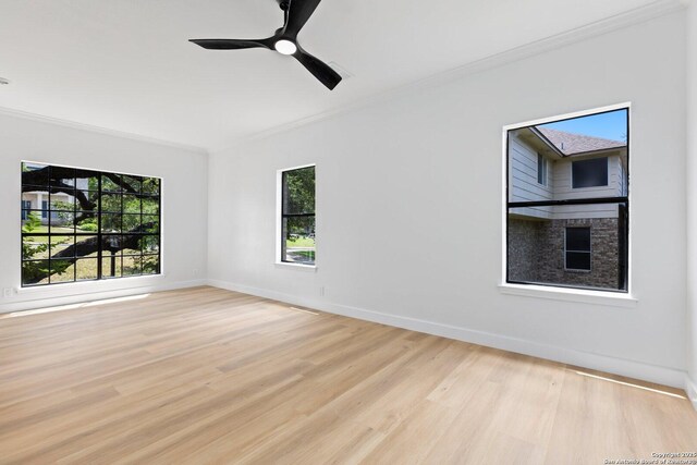 959 Lightstone Dr, San Antonio, TX 78258 - empty room featuring ornamental molding, light wood-style floors, baseboards, and ceiling fan