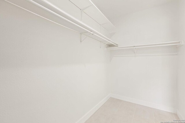 959 Lightstone Dr, San Antonio, TX 78258 - walk in closet with light tile patterned flooring