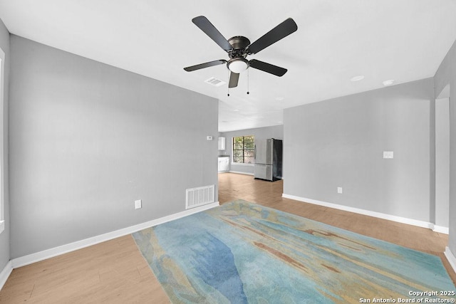 139 Wichita Ct, San Antonio, TX 78225 - spare room with wood finished floors, a ceiling fan, and baseboards