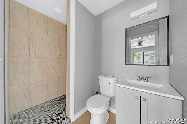 139 Wichita Ct, San Antonio, TX 78225 - bathroom with toilet, vanity, and a tile shower