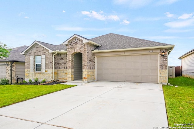 712 Monarch, Seguin, TX 78155 - french country style house featuring roof with shingles, stone siding, driveway, a garage, and a front yard