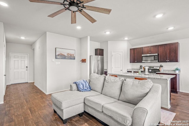 712 Monarch, Seguin, TX 78155 - living area featuring ceiling fan, baseboards, dark wood-style flooring, and recessed lighting