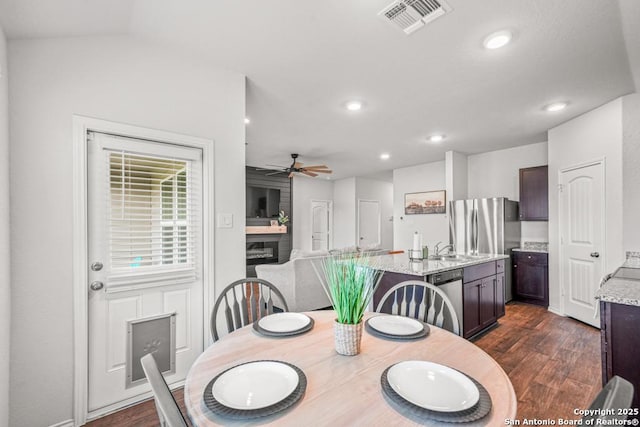 712 Monarch, Seguin, TX 78155 - dining room featuring dark wood-style floors, a ceiling fan, and recessed lighting