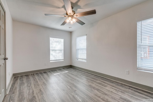 2822 Spokane, San Antonio, TX 78222 - unfurnished room featuring ceiling fan, wood finished floors, and baseboards