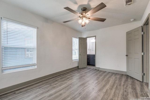 2822 Spokane, San Antonio, TX 78222 - spare room featuring ceiling fan, light wood finished floors, a smoke detector, and baseboards