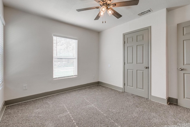 2822 Spokane, San Antonio, TX 78222 - unfurnished bedroom featuring carpet flooring, baseboards, and ceiling fan