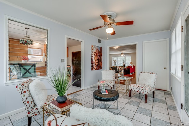 438 Cosgrove, San Antonio, TX 78210 - living room featuring ceiling fan, baseboards, crown molding, and light tile patterned floors