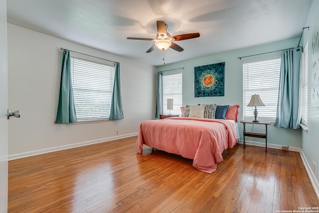 438 Cosgrove, San Antonio, TX 78210 - bedroom featuring light wood-style flooring, baseboards, and a ceiling fan