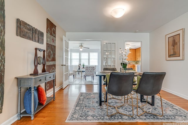 438 Cosgrove, San Antonio, TX 78210 - dining area featuring light wood-style floors, baseboards, and a ceiling fan