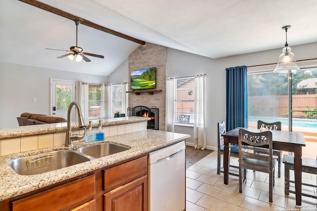13635 Oak Breeze, Universal City, TX 78148 - kitchen with white dishwasher, a sink, open floor plan, ceiling fan, and brown cabinetry