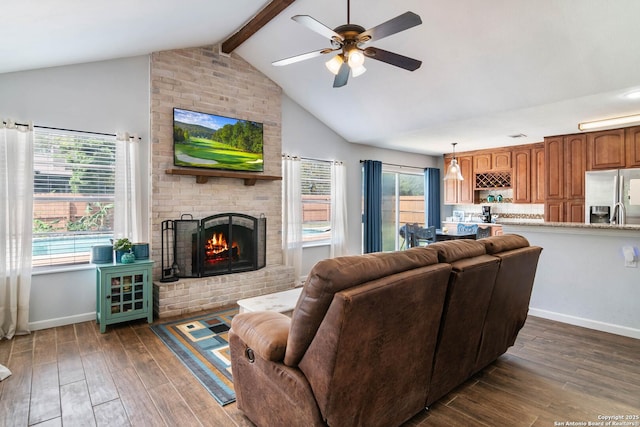 13635 Oak Breeze, Universal City, TX 78148 - living room with beamed ceiling, a brick fireplace, ceiling fan, dark wood-type flooring, and baseboards
