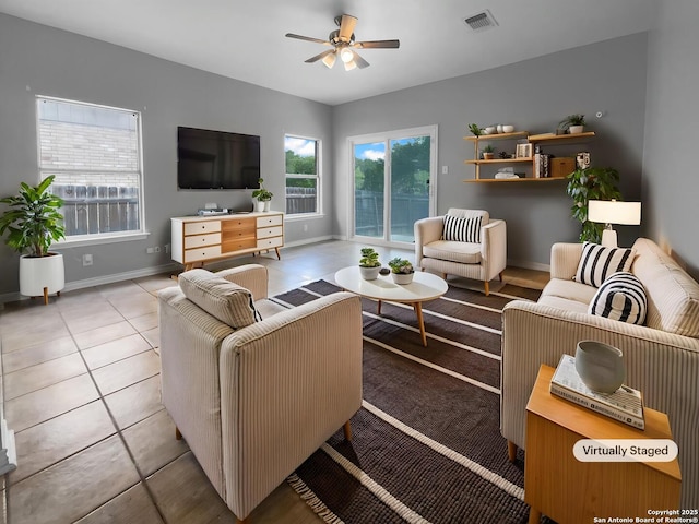 13611 Drakewood, San Antonio, TX 78247 - living room with a ceiling fan, baseboards, and light tile patterned floors