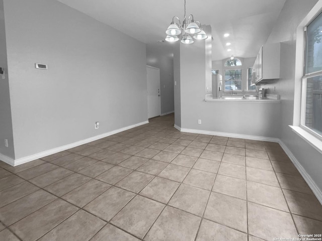 13611 Drakewood, San Antonio, TX 78247 - unfurnished dining area featuring a chandelier, tile patterned flooring, and baseboards