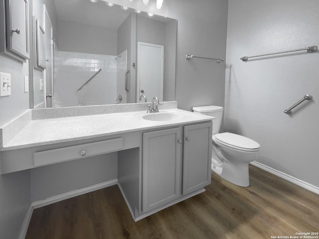 13611 Drakewood, San Antonio, TX 78247 - full bath featuring wood finished floors, vanity, toilet, and baseboards