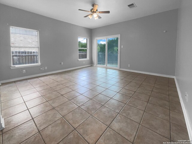 13611 Drakewood, San Antonio, TX 78247 - spare room featuring a ceiling fan, tile patterned floors, and baseboards