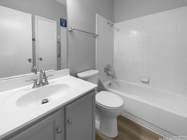 13611 Drakewood, San Antonio, TX 78247 - bathroom featuring vanity, toilet, shower / tub combination, and wood finished floors