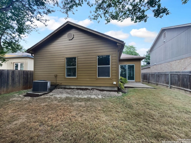 13611 Drakewood, San Antonio, TX 78247 - back of house with central AC and a patio