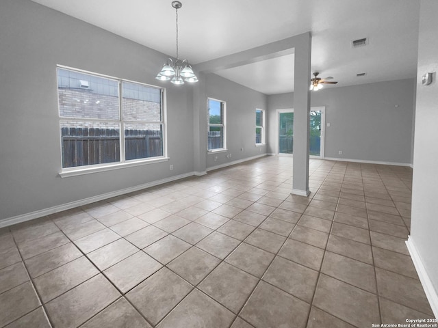 13611 Drakewood, San Antonio, TX 78247 - empty room with tile patterned flooring, a chandelier, a ceiling fan, and baseboards