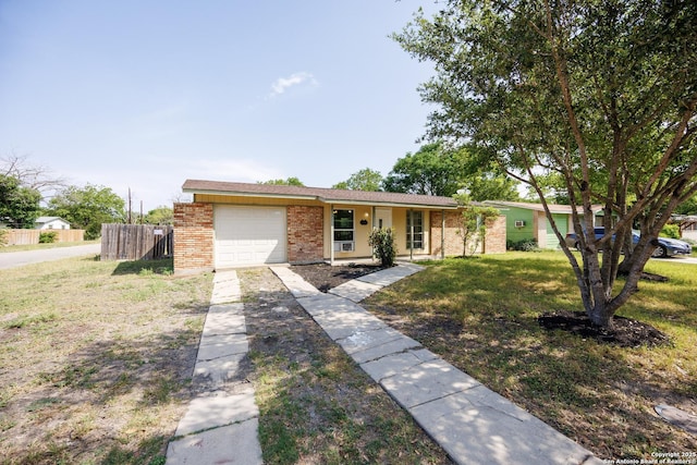 429 Aviation, Universal City, TX 78148 - ranch-style home with concrete driveway, brick siding, and a garage