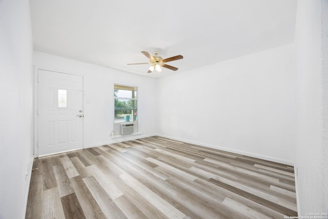 429 Aviation, Universal City, TX 78148 - empty room featuring a ceiling fan, light wood-type flooring, an AC wall unit, and baseboards