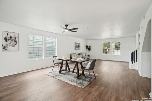 242 Butternut, San Antonio, TX 78245 - dining room featuring wood finished floors, baseboards, stairs, and ceiling fan