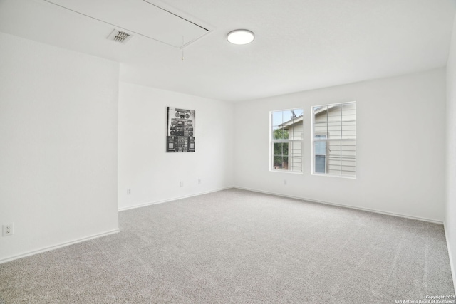 242 Butternut, San Antonio, TX 78245 - carpeted empty room with attic access and baseboards