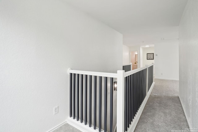 242 Butternut, San Antonio, TX 78245 - corridor with an upstairs landing, carpet, and baseboards