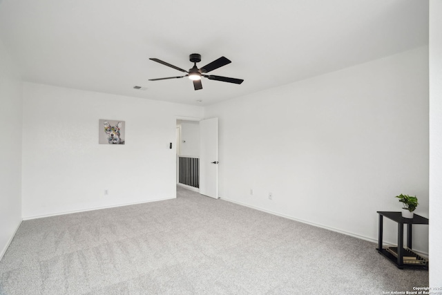 242 Butternut, San Antonio, TX 78245 - spare room with a ceiling fan, carpet floors, and baseboards