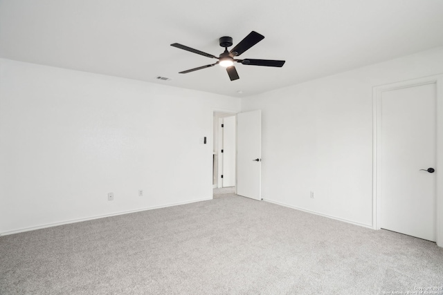 242 Butternut, San Antonio, TX 78245 - spare room featuring light carpet, ceiling fan, and baseboards