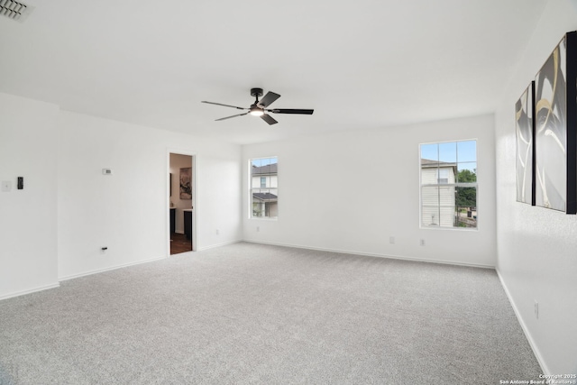 242 Butternut, San Antonio, TX 78245 - carpeted empty room with plenty of natural light, a ceiling fan, and baseboards