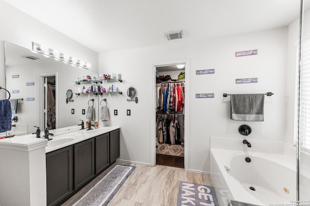 1623 Rainy Brk, Schertz, TX 78154 - full bath with a jetted tub, a spacious closet, double vanity, and baseboards