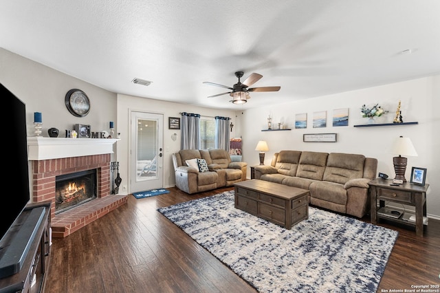 1623 Rainy Brk, Schertz, TX 78154 - living area with a ceiling fan, dark wood-type flooring, and a fireplace